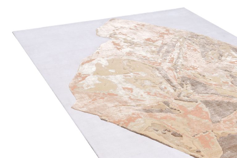 abstract design odd shape rug in neutral colors by cara woodhouse Interiors. rug art nyc