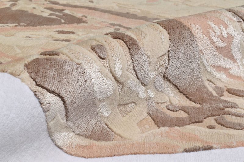 abstract design odd shape rug in neutral colors by cara woodhouse Interiors. rug art nyc