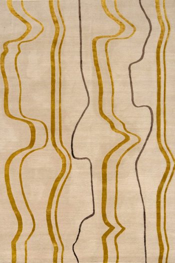 Geometric linear rug desig Boogi. Beige, gold and brown rug.