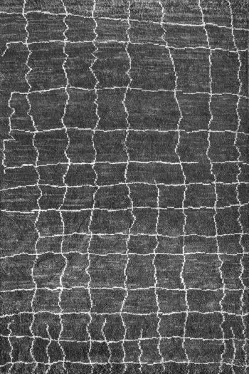 Moroccan geometric design rug in black and white.