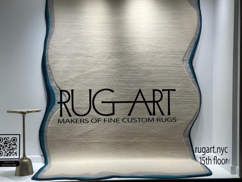 odd shape rug with border in cream and blue from rug art nyc
