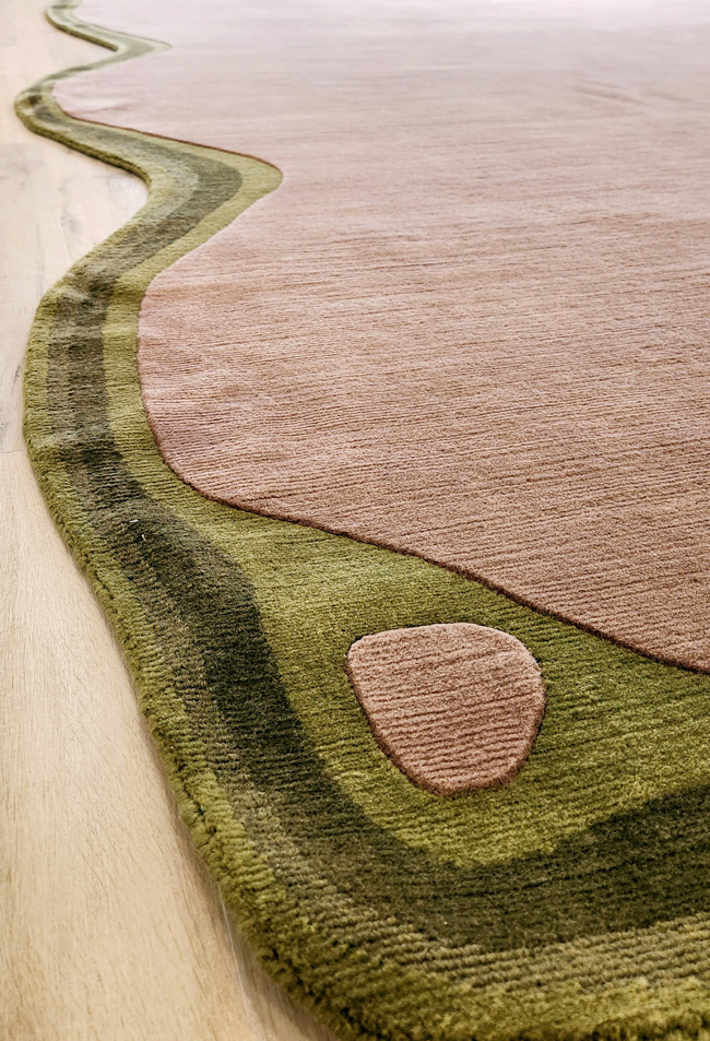 odd shape rug with border in green and brown from rug art nyc