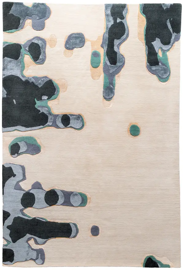 abstract rug "Drips" showing liquid-like shapes pooling and dripping from one side across a cream background